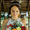 An AD Artistry bride looking down at her flowers